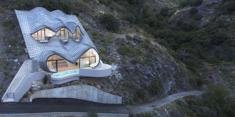 Remote stone house on a mountain slope