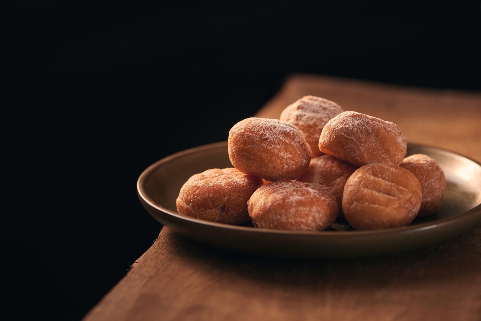 Small donuts with powdered sugar